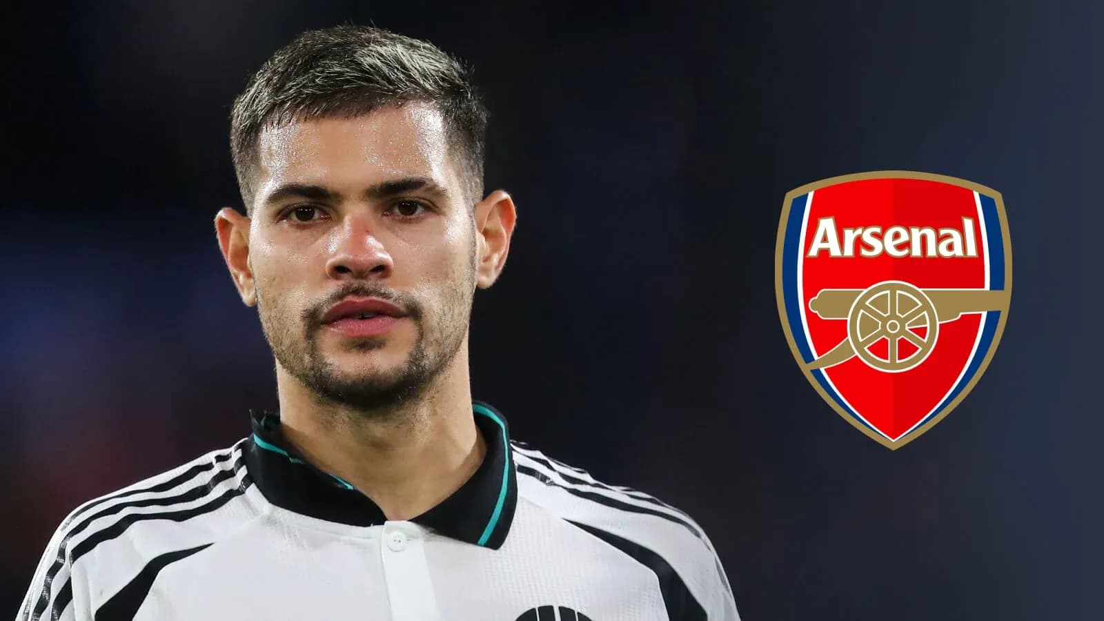 Player posing with Arsenal logo in background