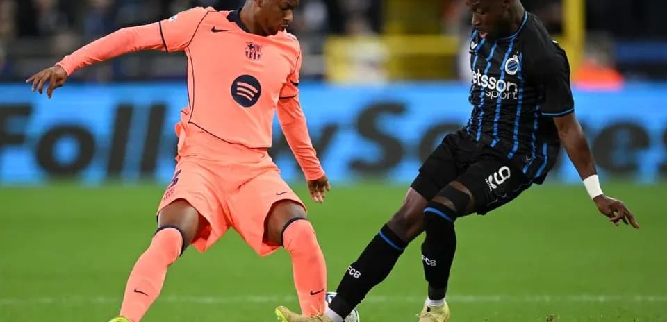 Two players challenging for the ball during match