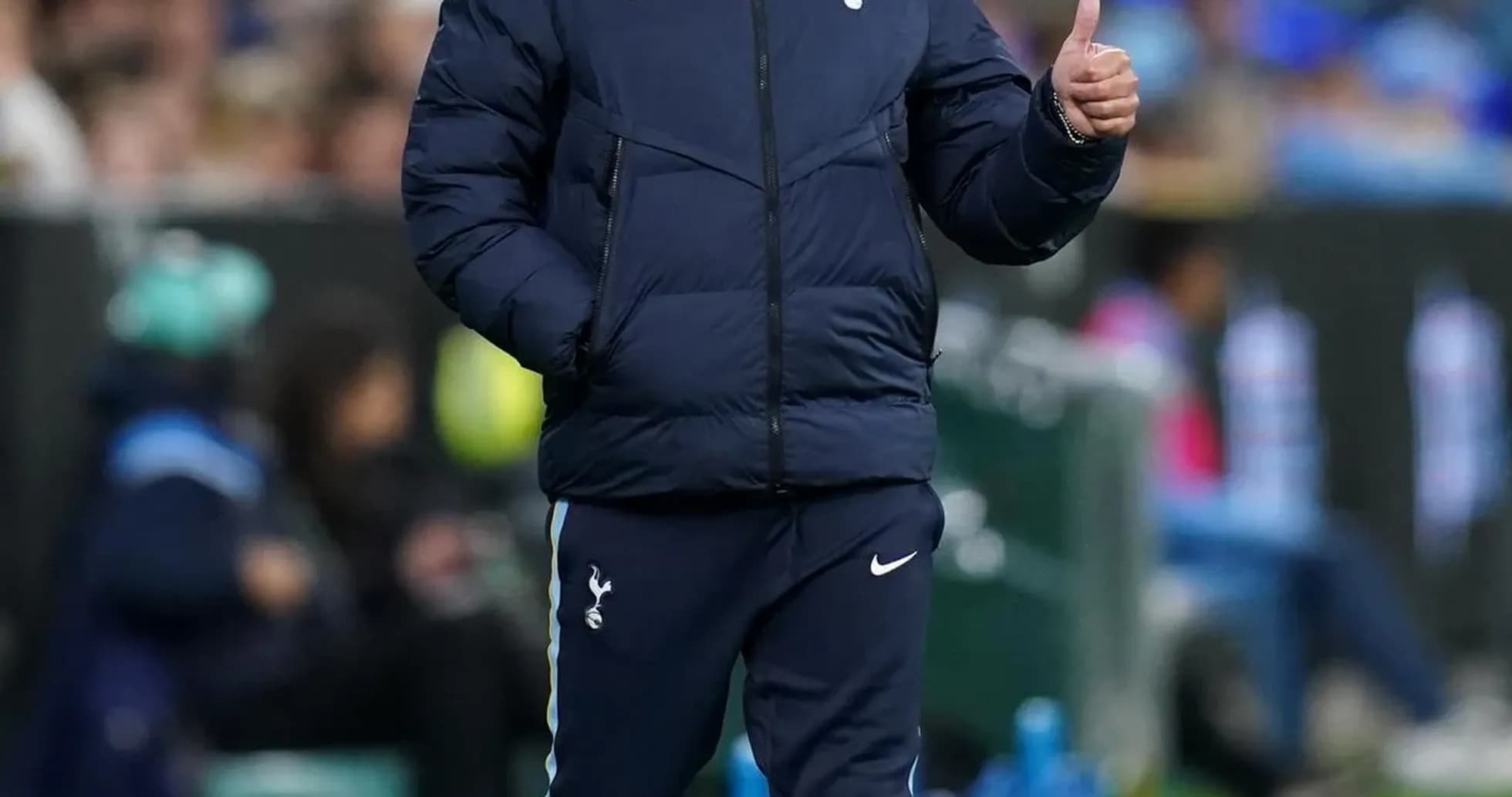 Manager giving a thumbs up on the sidelines