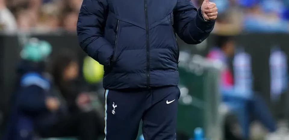 Manager giving a thumbs up on the sidelines