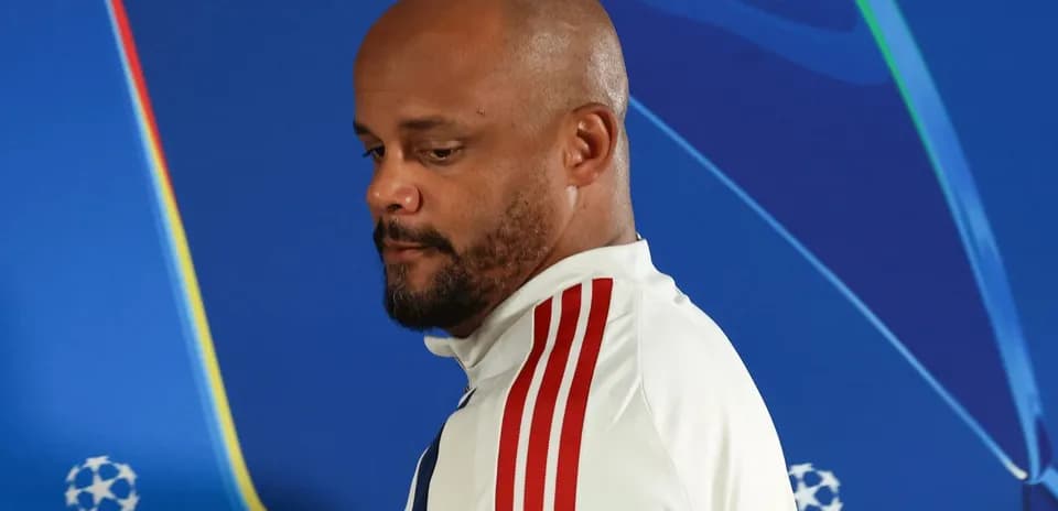 Manager walking away from UEFA Champions League backdrop