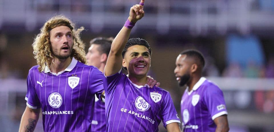 Louisville City players celebrating a goal