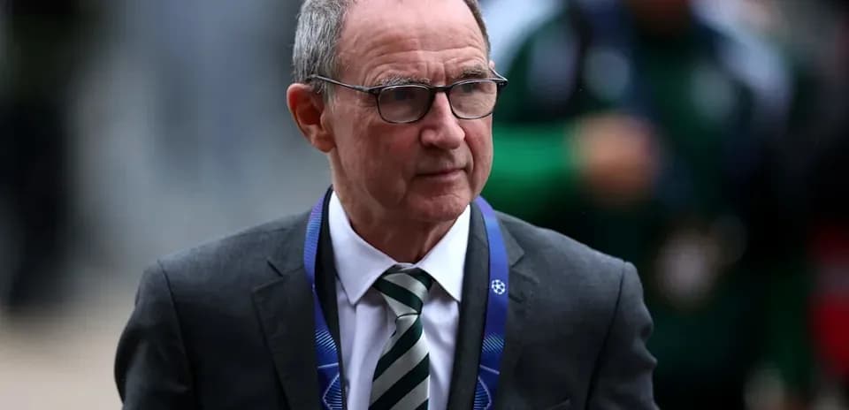 Man in suit with glasses arriving at event