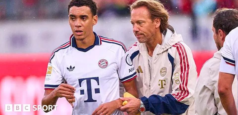 Player receiving assistance from coach on the sidelines