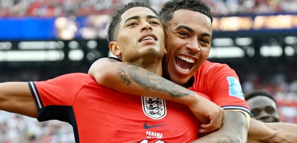 Two players celebrating a goal on the field