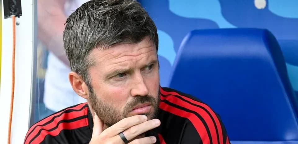 Coach sitting on bench during match