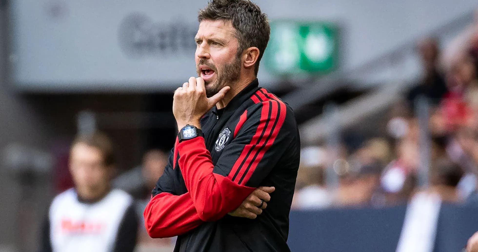 Coach gesturing during match on the sidelines