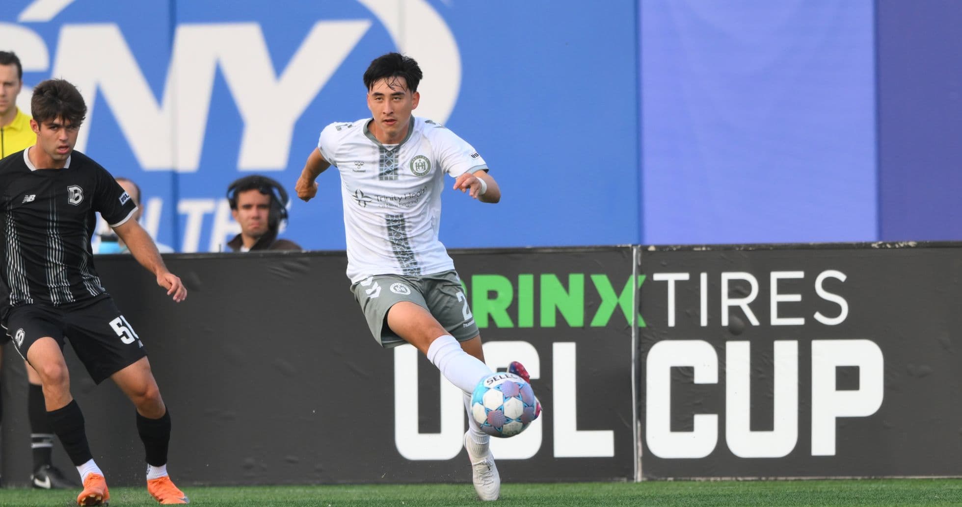 Player dribbling ball during NY Cosmos match