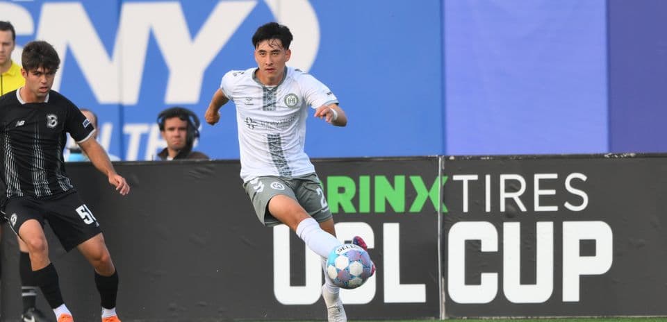 Player dribbling ball during NY Cosmos match