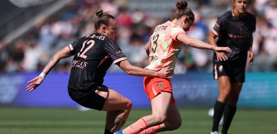 Portland Thorns player tackles Utah Royals opponent