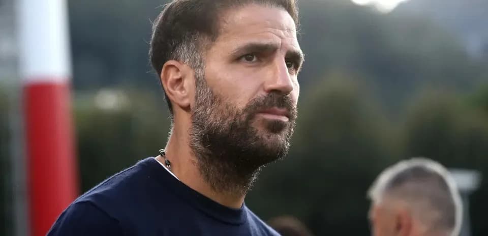 Coach observing players during training session