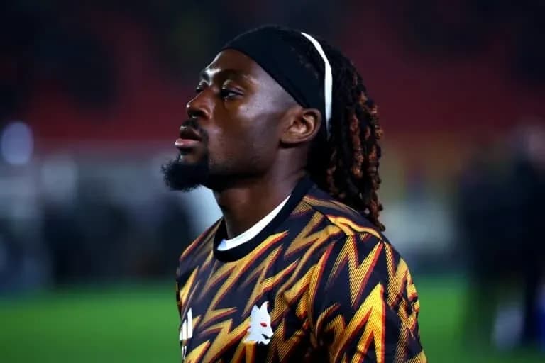 Player in colorful jersey during pre-match warm-up