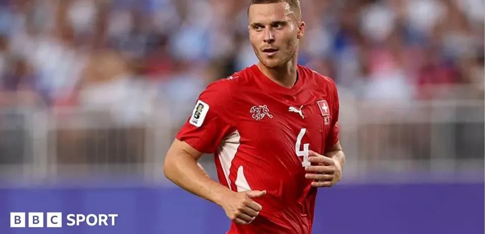 Player in red Switzerland jersey during match