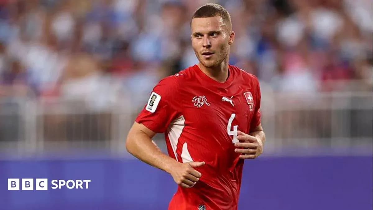 Player in red Switzerland jersey during match