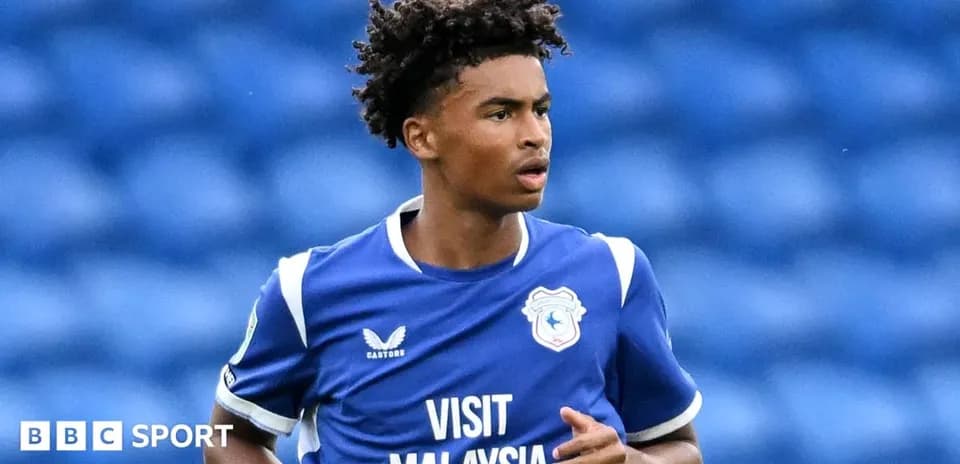 Player in blue kit during match action