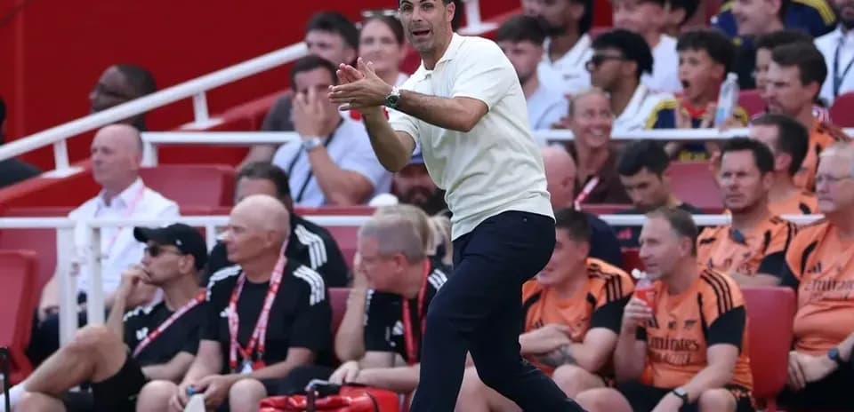 Coach gesturing from the sidelines during match