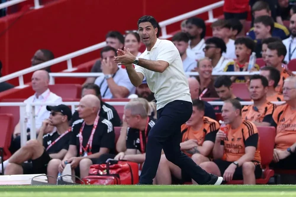 Coach gesturing from the sidelines during match