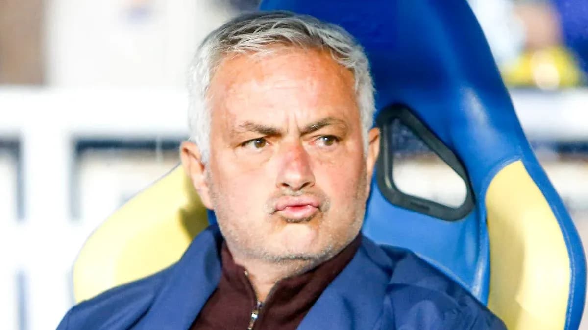Coach sitting on bench during a match