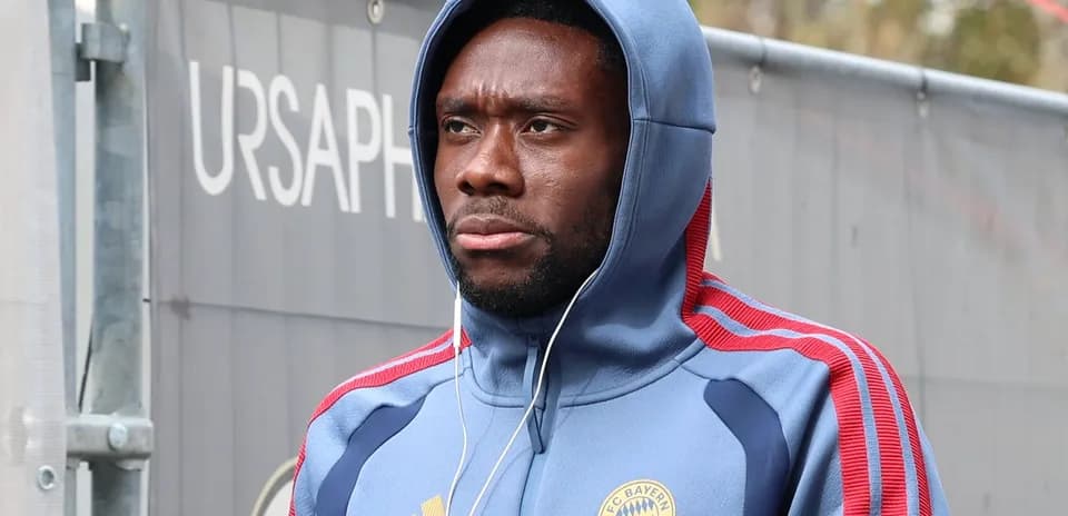 Player in FC Bayern Munich hoodie arriving at venue