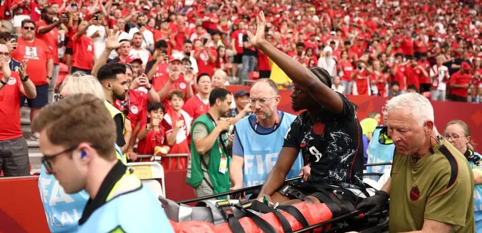 Player being stretchered off with medical staff