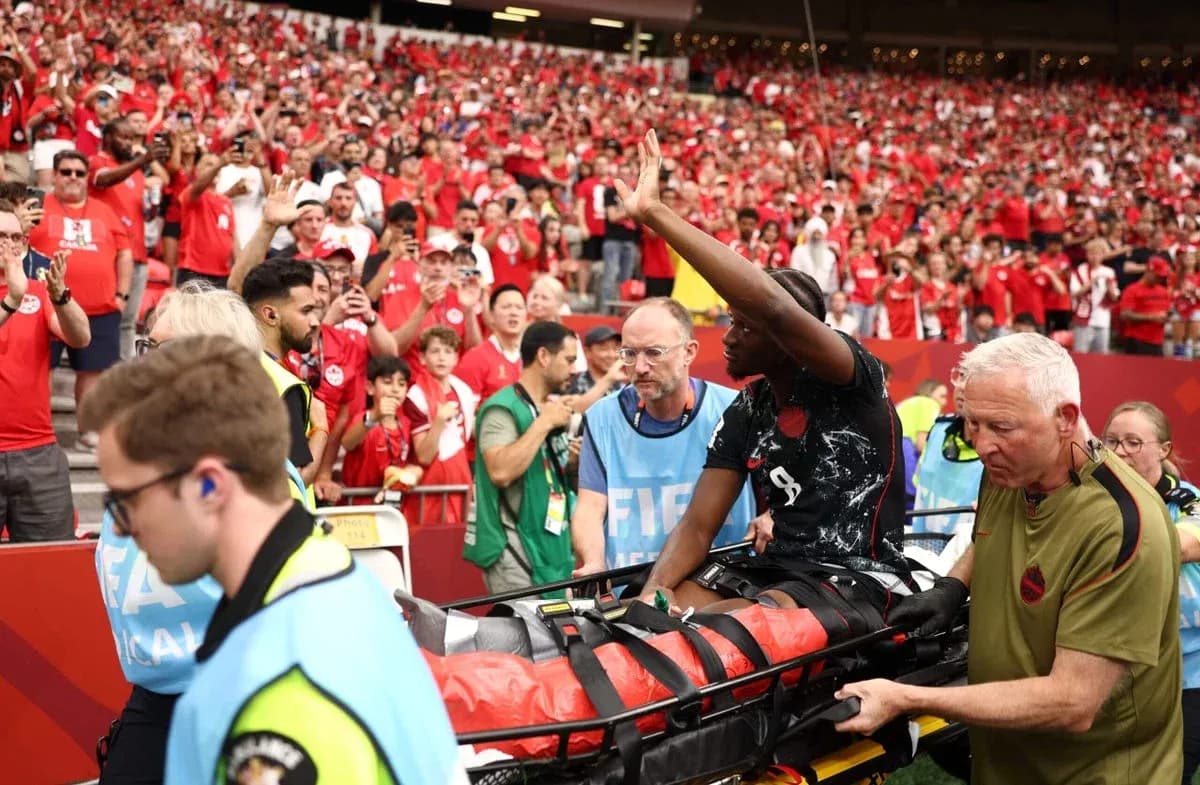 Player being stretchered off with medical staff