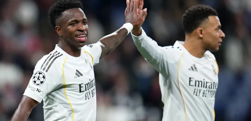 Vinícius Júnior and Kylian Mbappé celebrating a goal