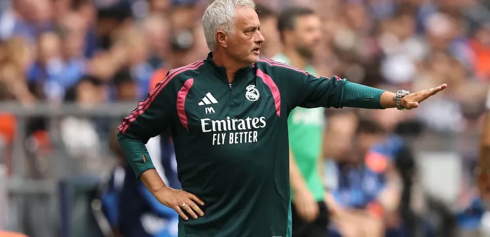 Manager directing players during a match