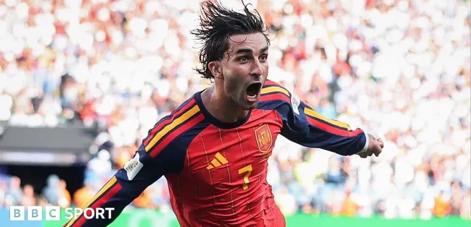 Player celebrating goal in Spain national team jersey
