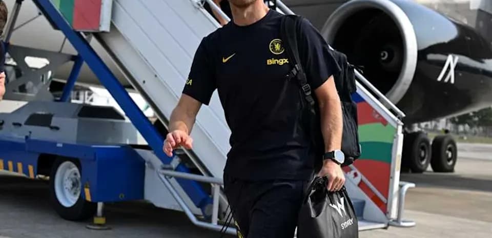 Man in sportswear walking from airplane stairs
