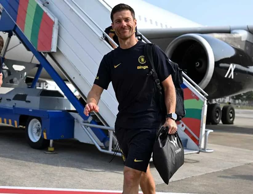Man in sportswear walking from airplane stairs