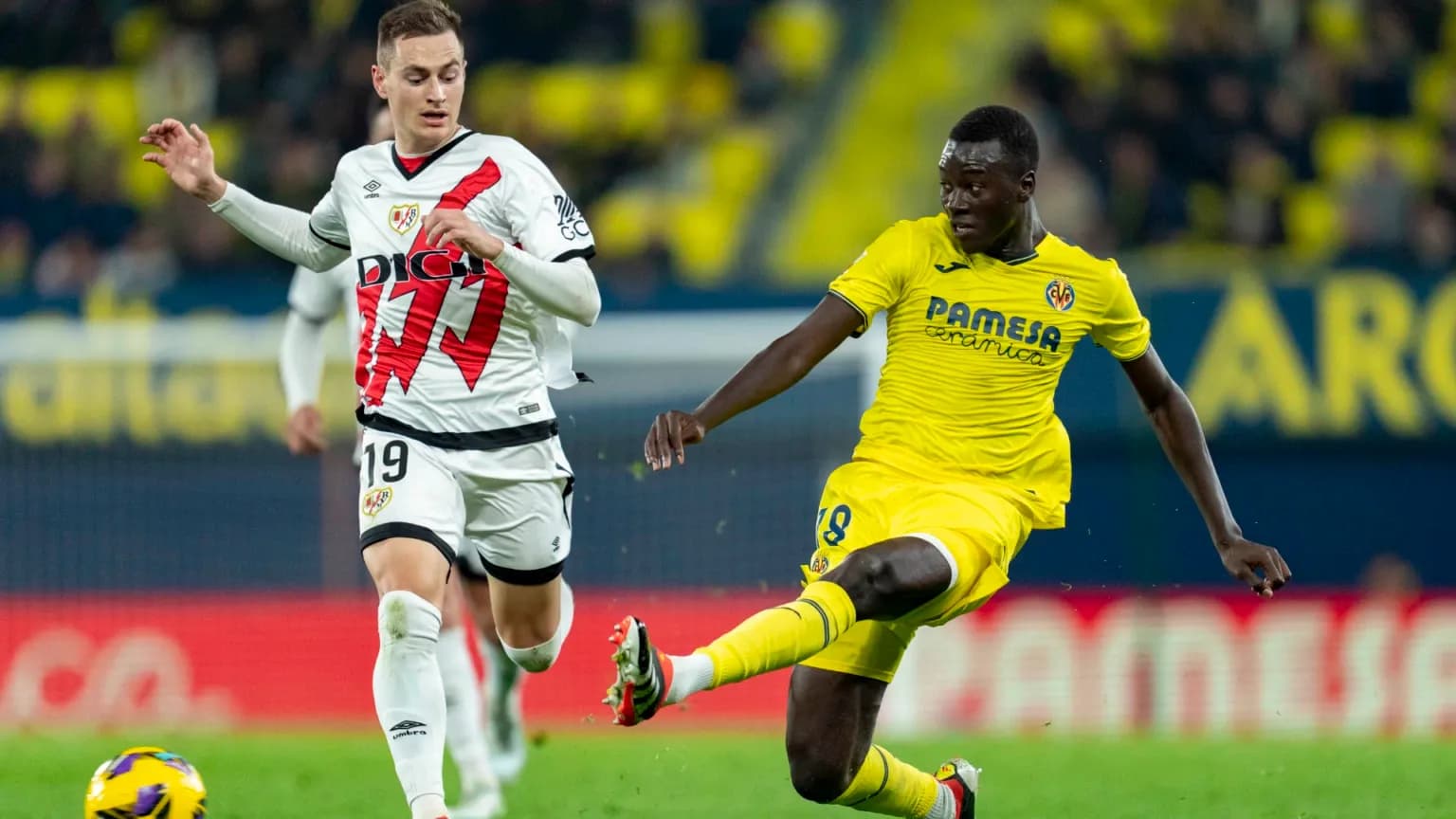 Rayo Vallecano and Villarreal players in action