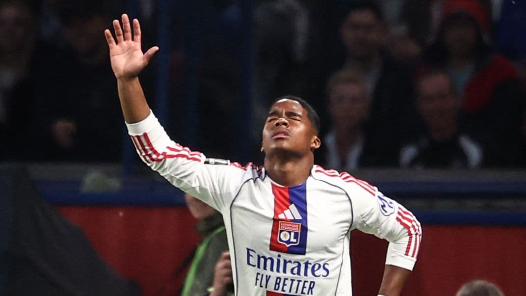 Player celebrating with arms raised during match