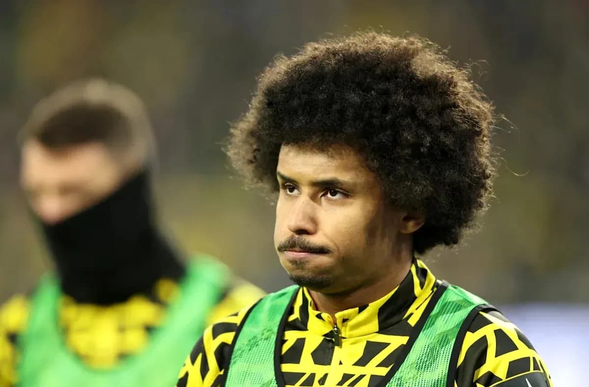 Player in training gear during match warm-up