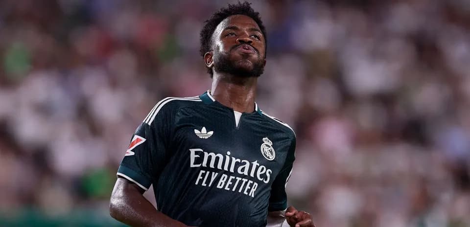 Player in Real Madrid jersey on the pitch