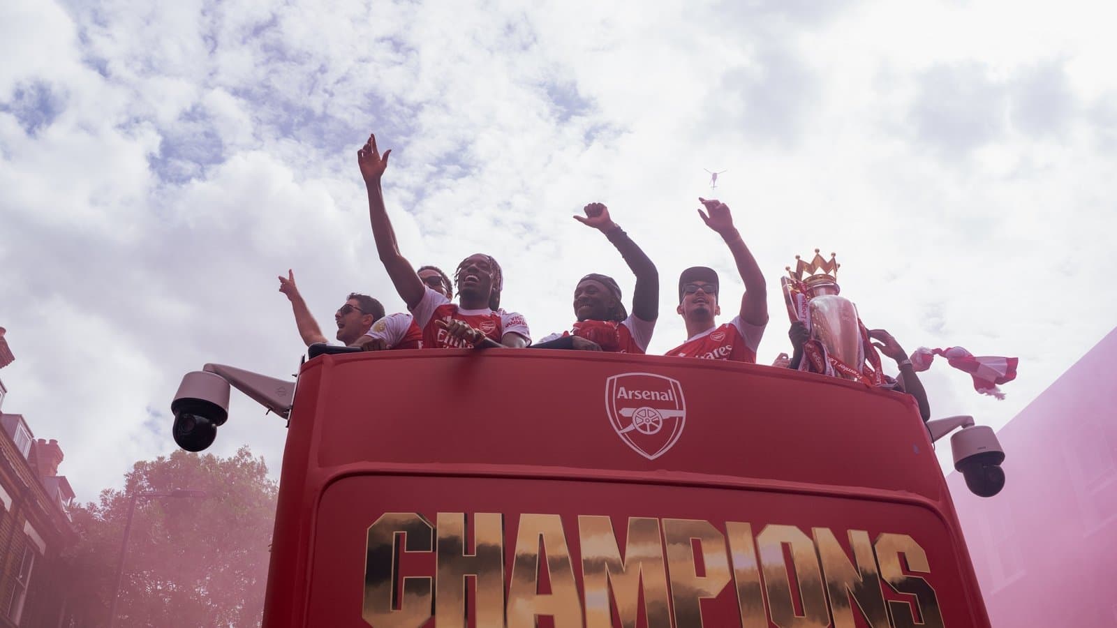 Arsenal players celebrating on open-top bus parade