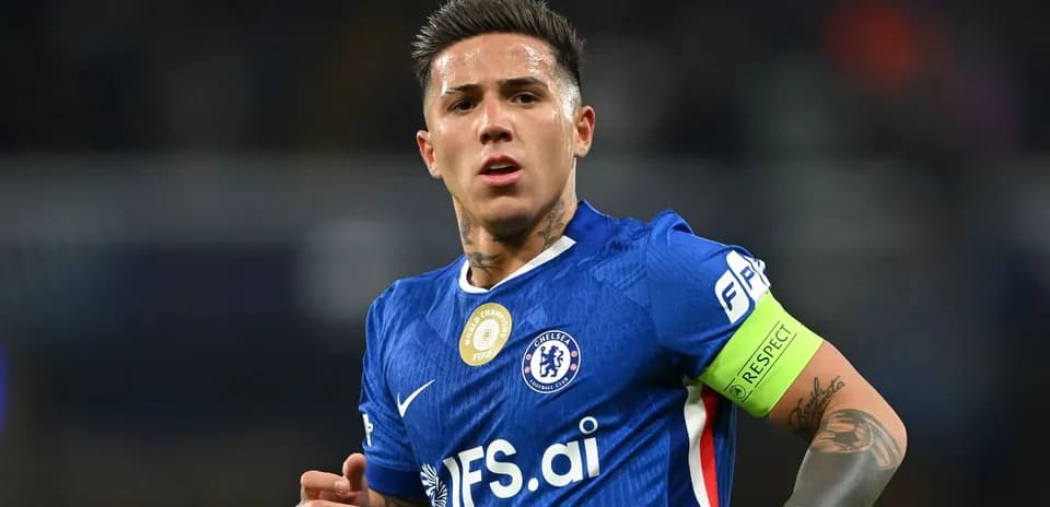 Player in blue jersey with captain's armband during match