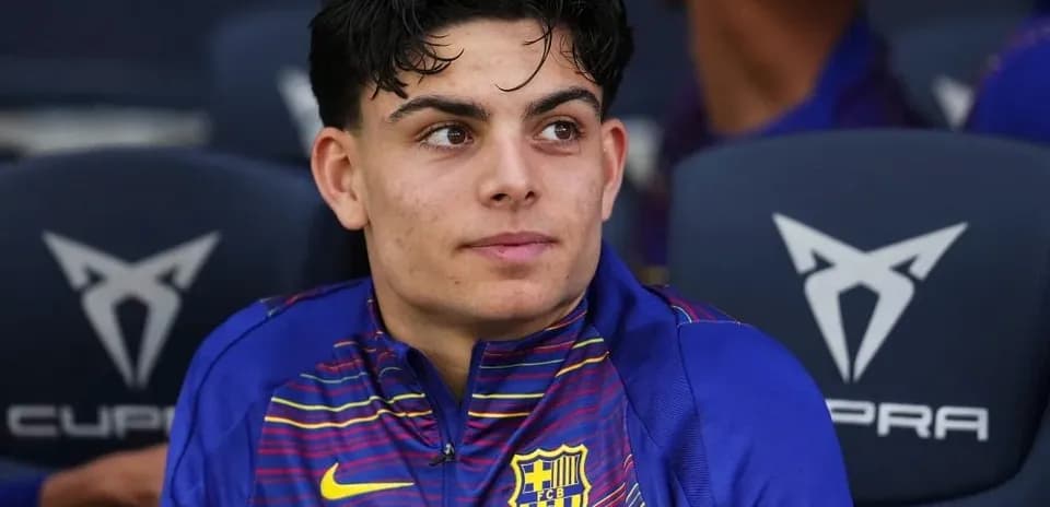 Barcelona player sitting on the bench during match