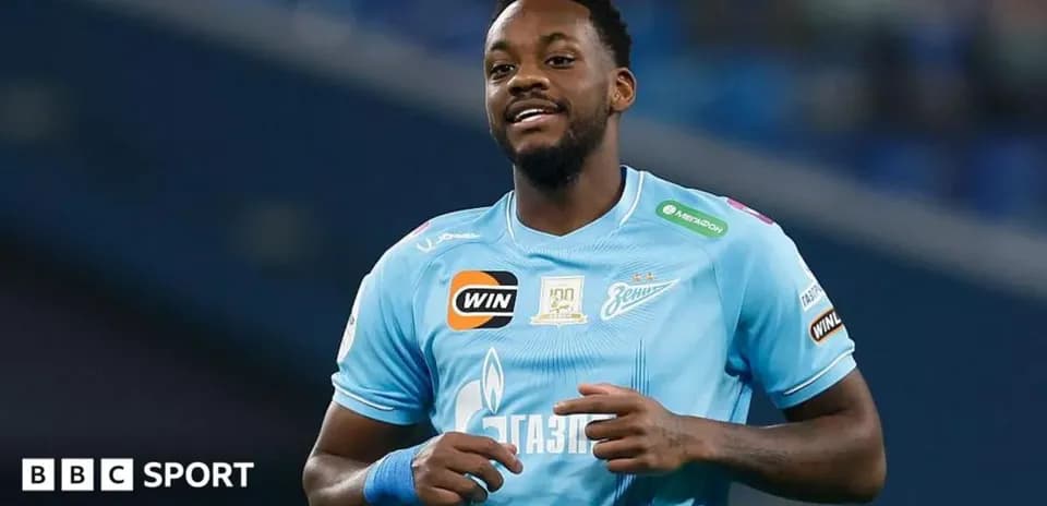 Player in light blue jersey smiling during match