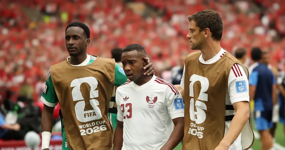 Players assisting teammate off the field during match
