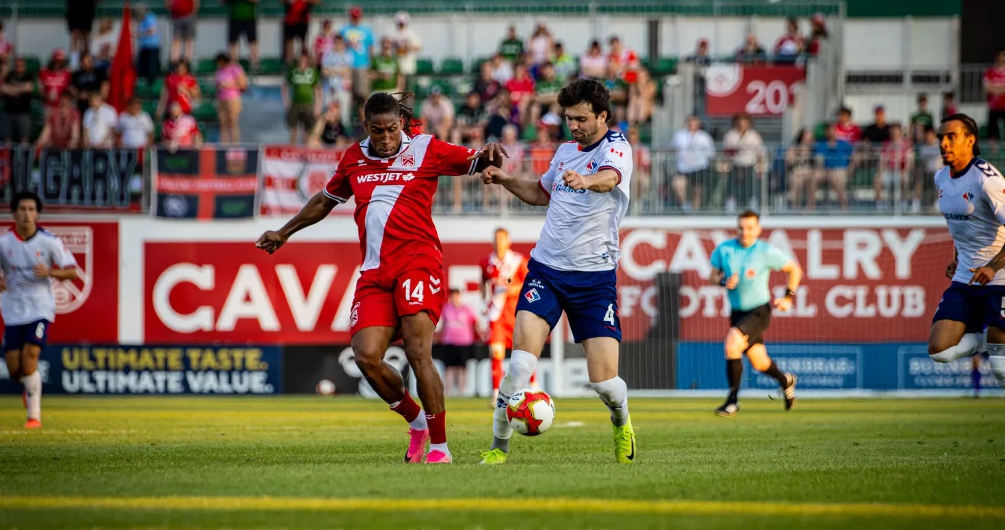 Players competing for the ball during match