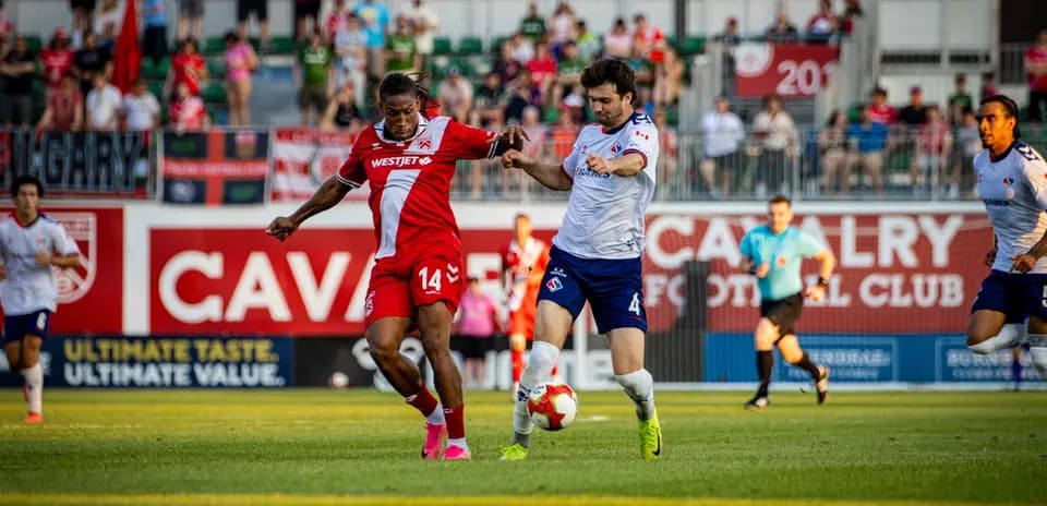 Players competing for the ball during match
