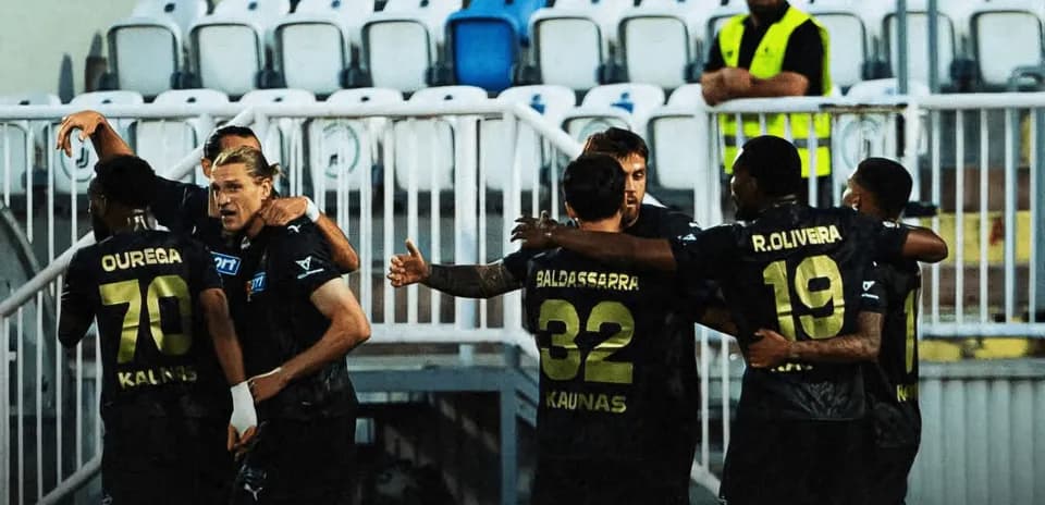 Players celebrating after a goal during match
