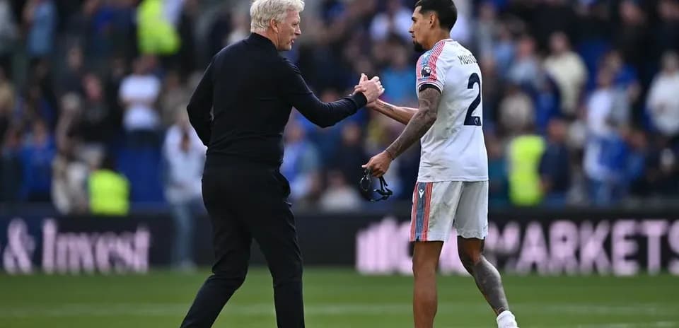 Coach shaking hands with player after match