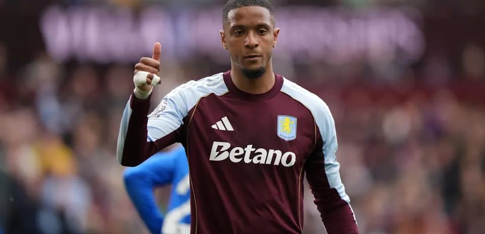 Goalkeeper in Aston Villa kit giving thumbs up