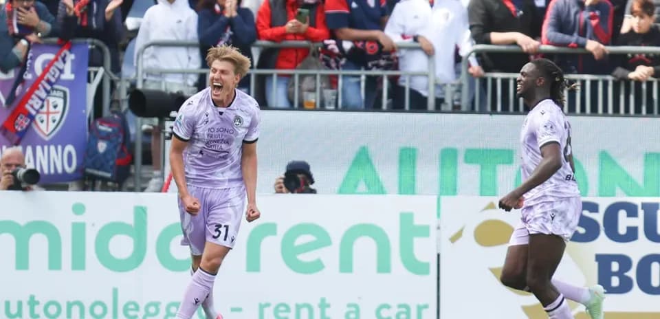 Udinese players celebrating a goal against Cagliari