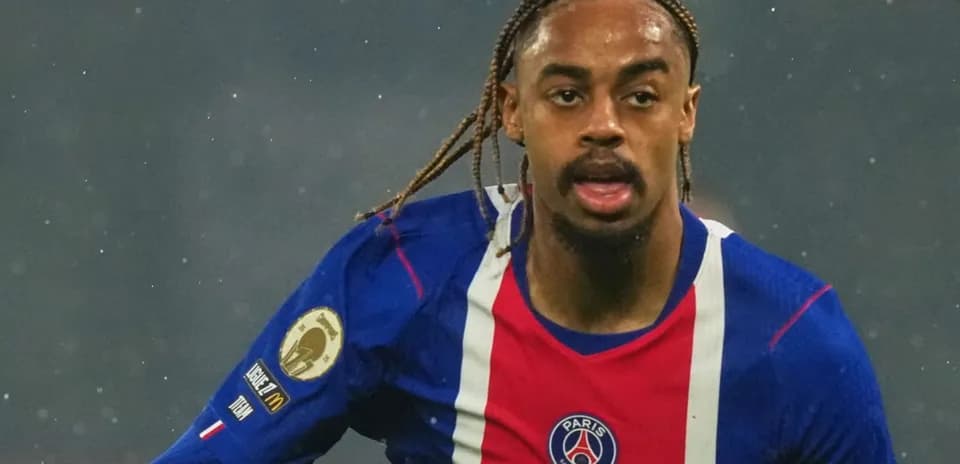Player running in Paris Saint-Germain jersey during match