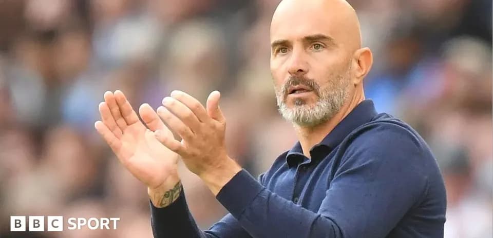Coach clapping and giving instructions during match