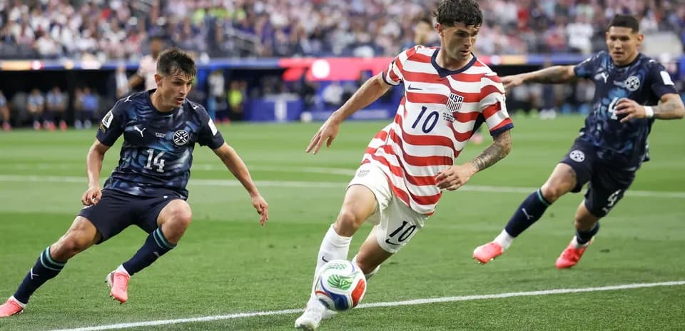 Player dribbling past opponents during soccer match