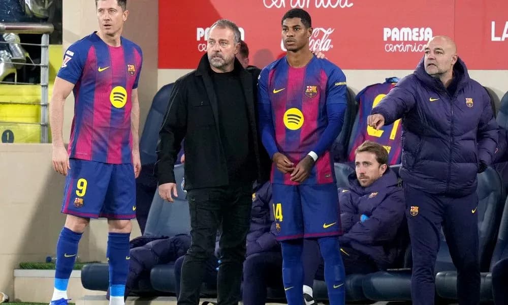 Barcelona players and staff on the sidelines during match