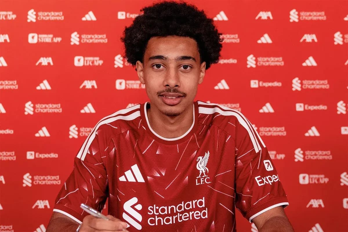 Player signing contract at Liverpool FC announcement